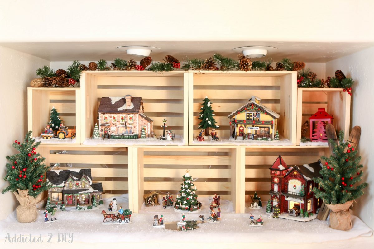 Give your traditional Christmas village a new look and utilize vertical space with crates! They are also a great way to decorate year round!
