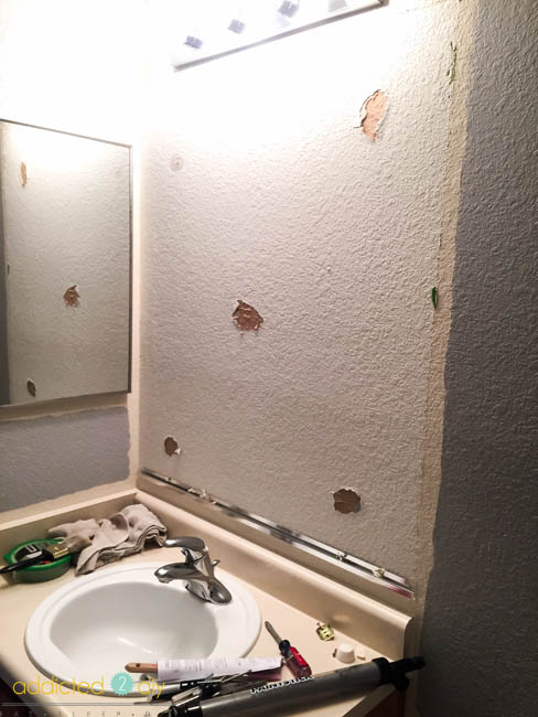 bathroom makeover - taking out builder grade mirror