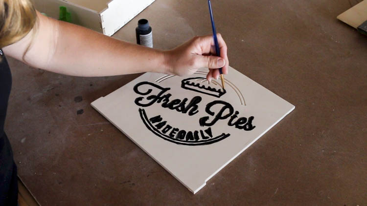 Painting The Design On A Pie Box