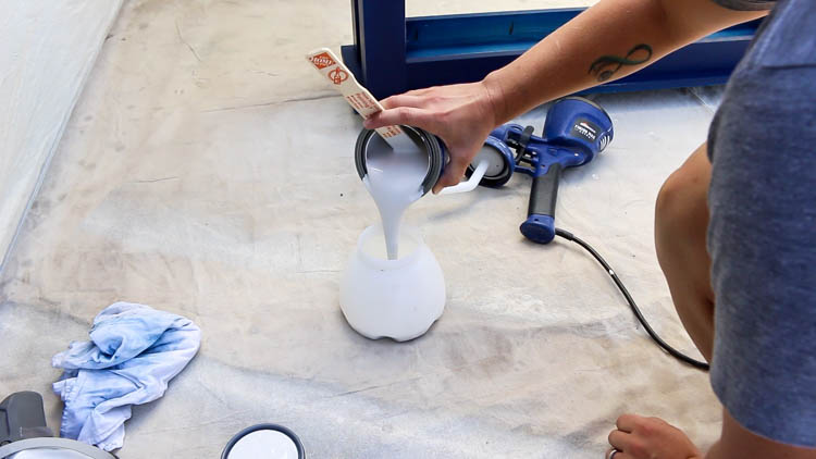 pour paint into sprayer