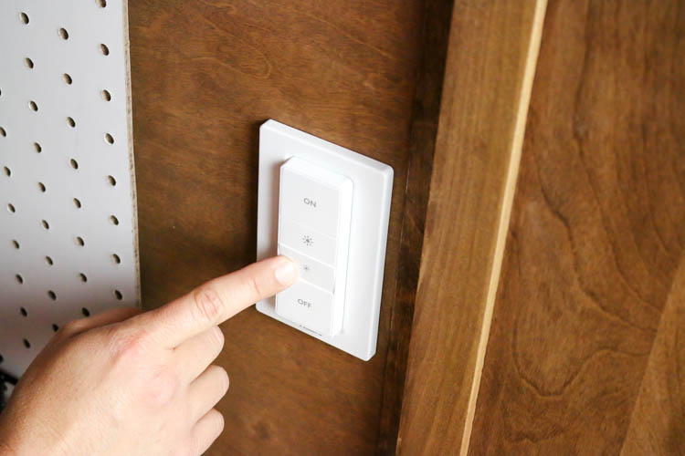 pressing button on light switch