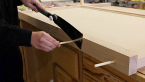 cutting dowels with saw