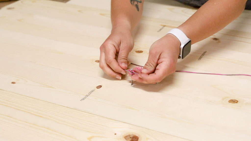 tying string around nail