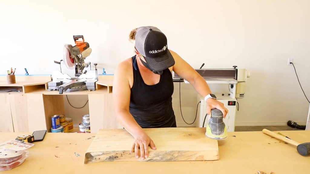 sanding down a live edge slab
