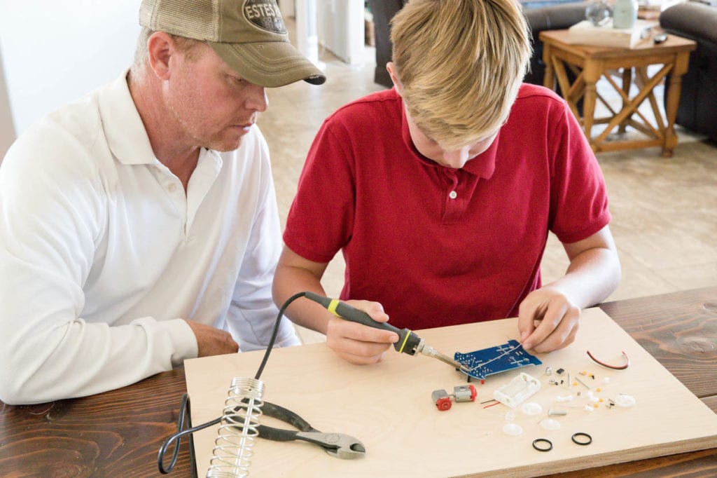 13 year old soldering a smart car project