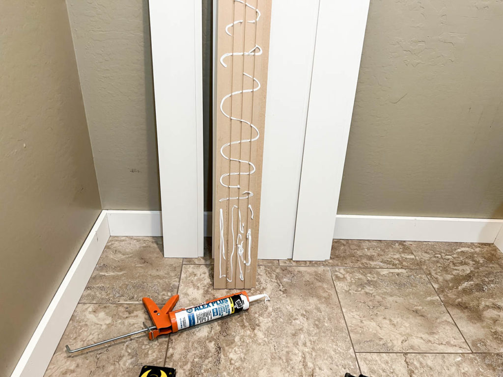 applying adhesive to vertical shiplap