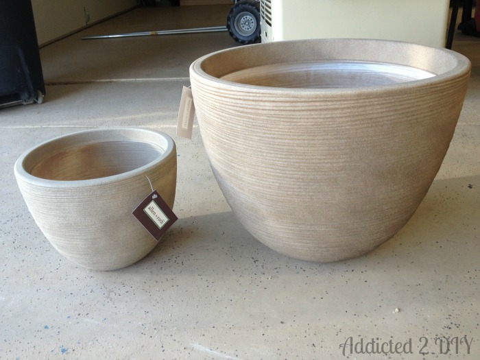 Different sized planter pots used to create a DIY tiered water fountain project