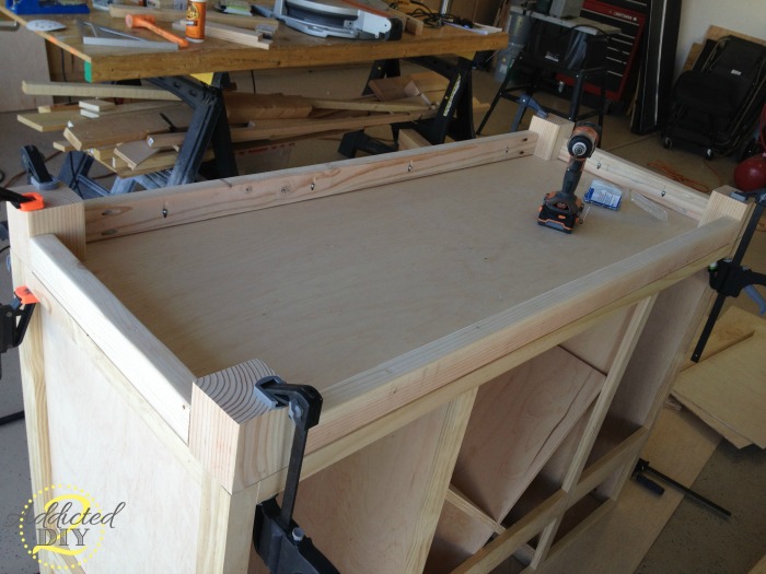 Attaching corner legs and upper support frame to the DIY kitchen island base