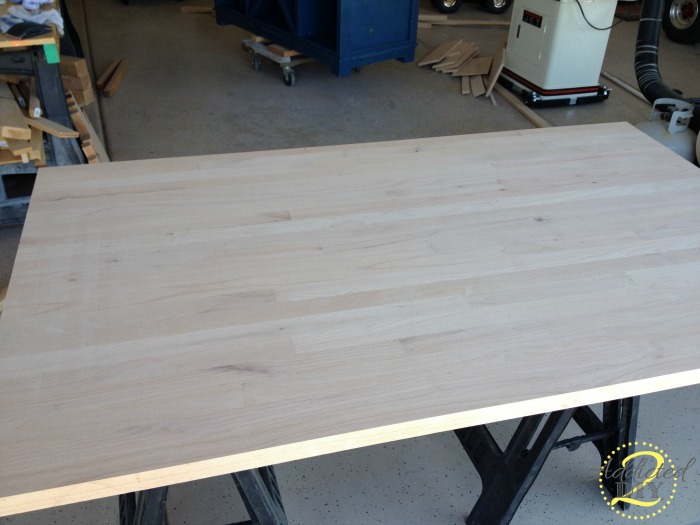 Freshly sanded DIY butcher block countertop with smooth surface before applying finish