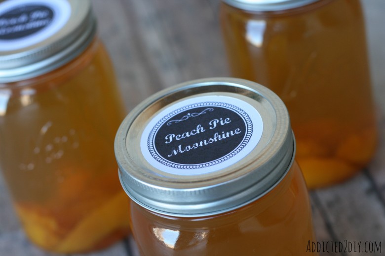 Close-up of peach pie moonshine mason jar with custom label