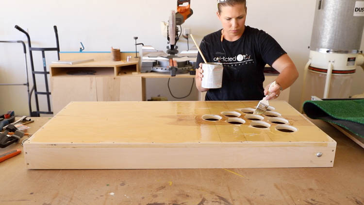 brushing contact cement onto chip shot golf game