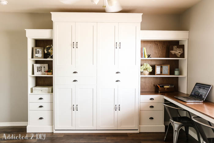 Modern farmhouse DIY Murphy bed with built-in bookcases and desk in home office
