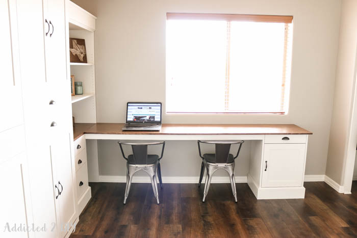 Built-in desk and shelving under window