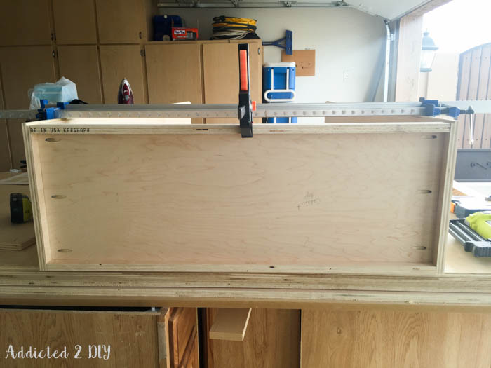 Plywood cabinet box clamped during assembly
