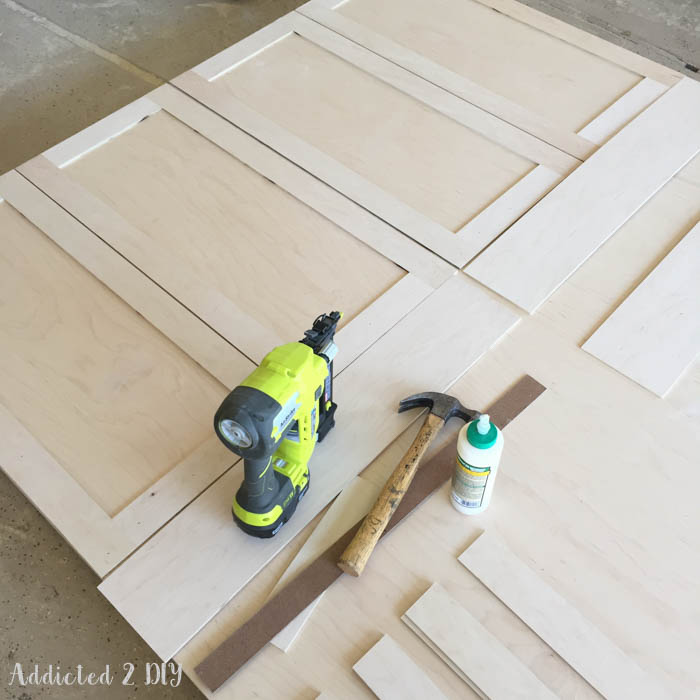 Attaching decorative trim to Murphy bed front panels using brad nailer