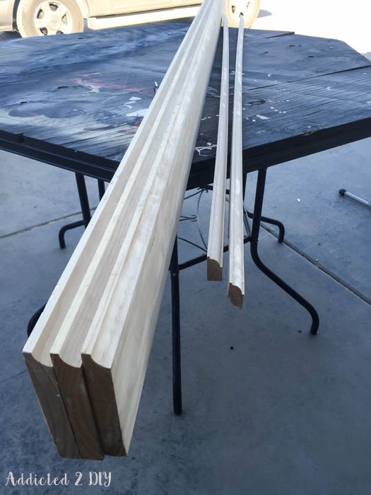 Custom wood moulding pieces cut for DIY Murphy bed trim detail