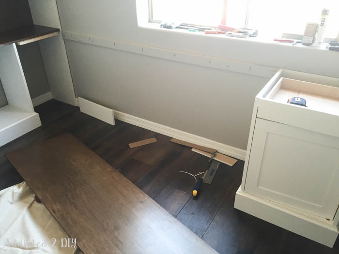 Desk installation area with flooring and baseboards