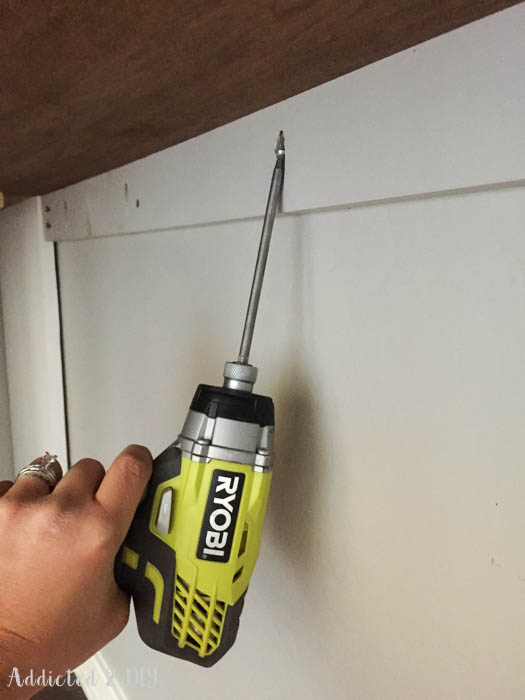 Securing desk cleat to wall with drill