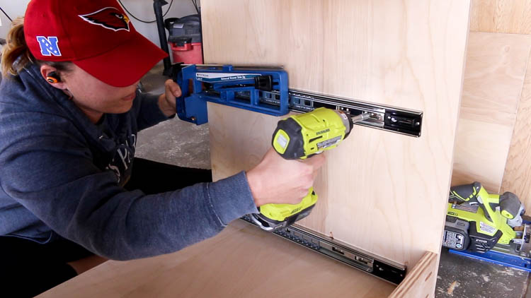 Installing 22-inch side-mount drawer slides inside a DIY miter saw bench cabinet using the Rockler Universal Drawer Slide Jig