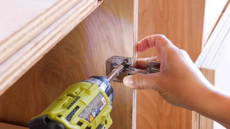 Installing euro cup hinges on plywood cabinet doors for a DIY miter saw bench
