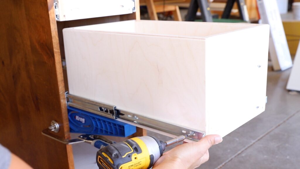 Installing 18-inch side-mount drawer slides on a plywood drawer box using a Kreg jig