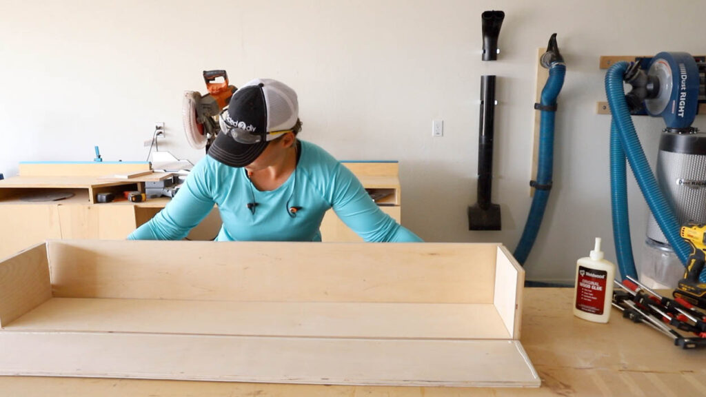 assembling the drawer box using pocket screws and clamps for the fireplace