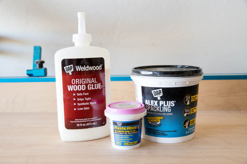DAP wood glue, Plastic Wood-X, and Alex Plus spackling used for DIY faux fireplace project