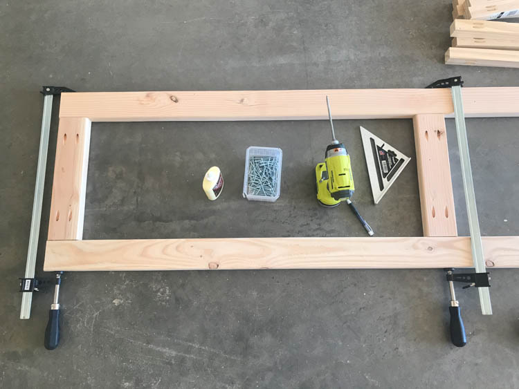 2x4 lumber frame clamped and squared for DIY rustic hall tree build