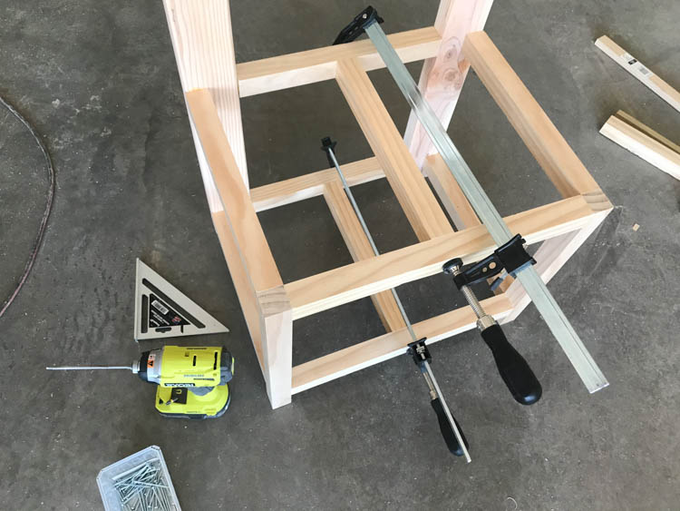 Hall tree frame with center supports attached and clamped square