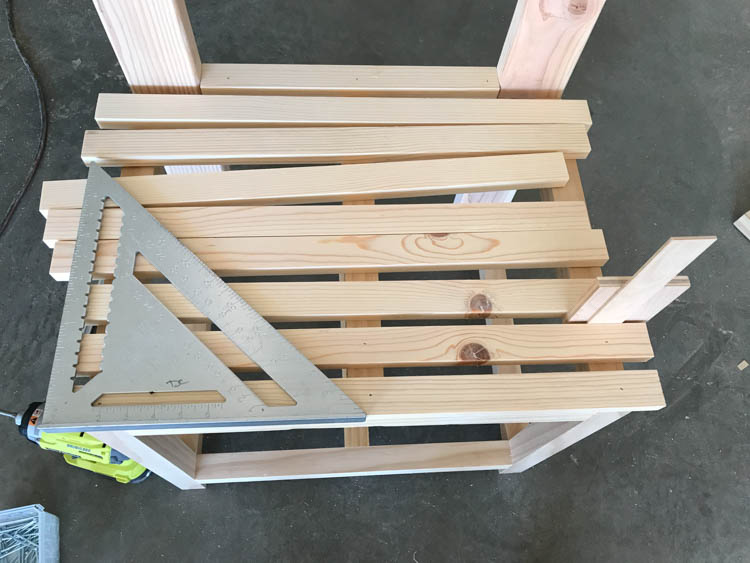 Checking bench seat slat spacing with a framing square