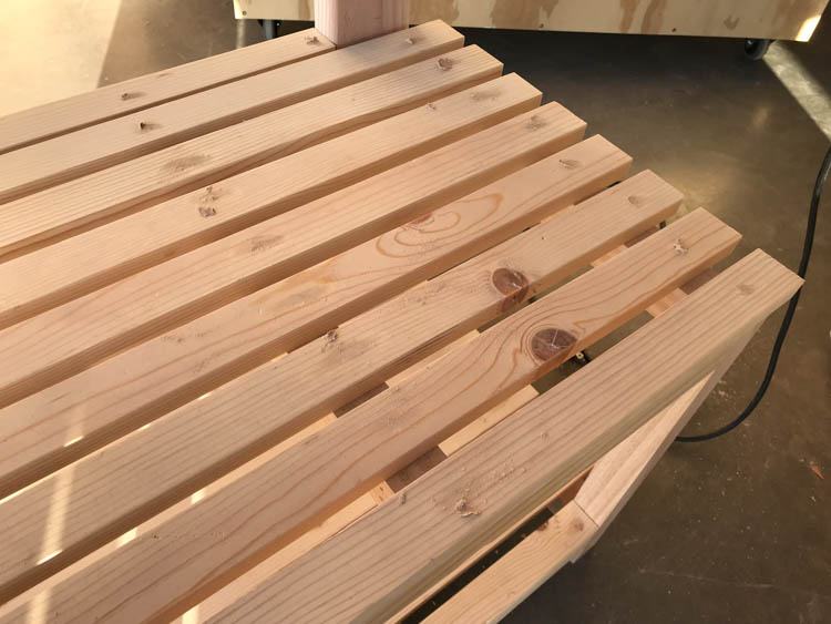Completed shelf slats installed on DIY rustic hall tree