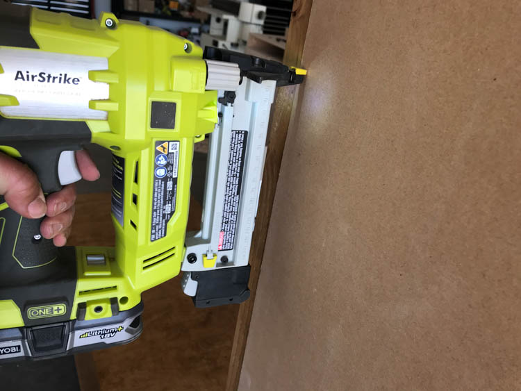 Attaching chalkboard panel to hall tree back with Ryobi AirStrike nailer