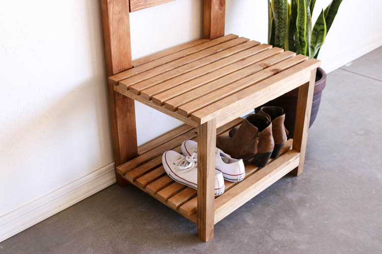 Close-up of DIY hall tree slatted bench seat with shoe storage shelf underneath