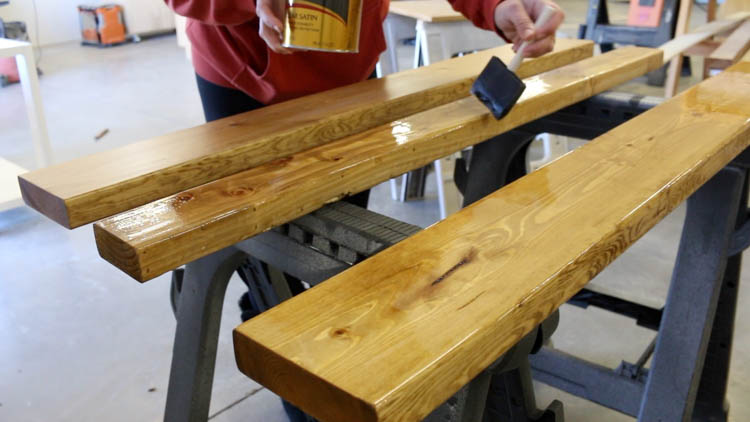 Applying golden oak stain and satin polyurethane finish to farmhouse console tabletop boards