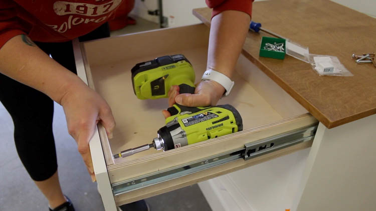 Permanently attaching a drawer front to a drawer box from the inside using a Ryobi drill and screws