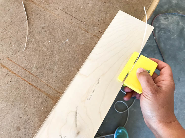 Applying veneer edge banding to plywood edges for a painted nightstand build