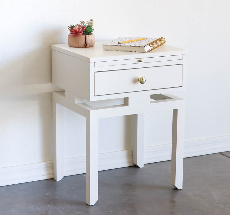 Finished white DIY nightstand with faux floating top, brass hardware, and modern design