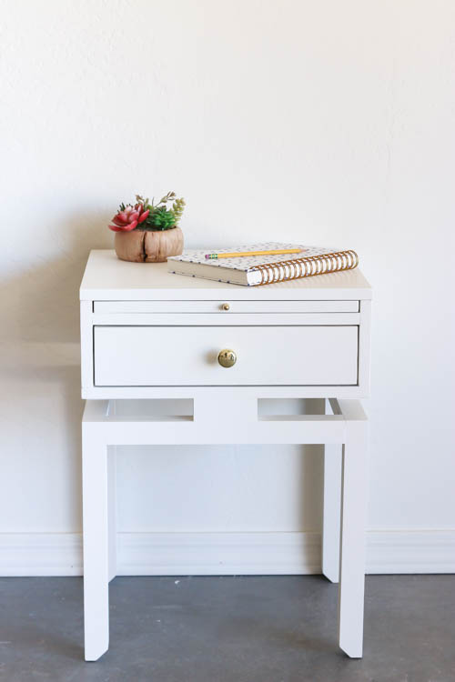 Front view of a modern white DIY nightstand with drawer storage and floating top detail
