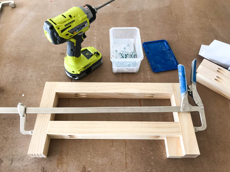 Pocket hole joinery used to assemble the side leg frame for a DIY storage bench