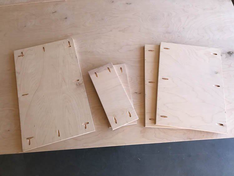 Plywood panels and small blocks with pocket holes drilled for assembly of a DIY West Elm inspired coffee table