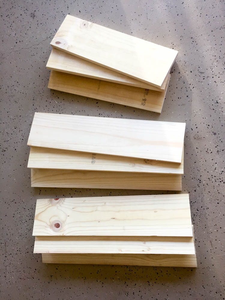 Stacked pine boards cut to size for a DIY rustic nightstand build