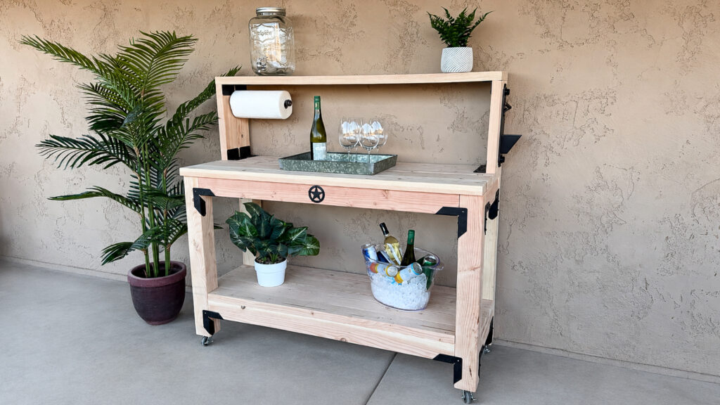 An angled view of the mobile outdoor console table with a view of the bottle opener