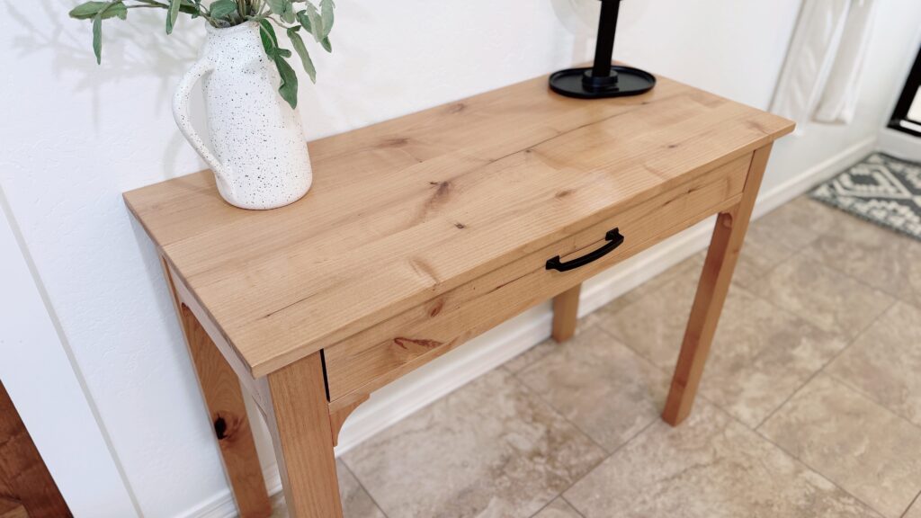 top view of makeup table with a vase and a mirror
