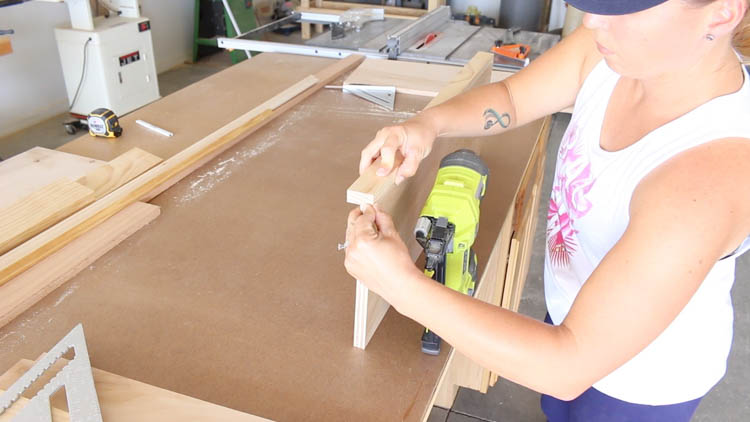 Nailing the face frame board to the cabinet side panel