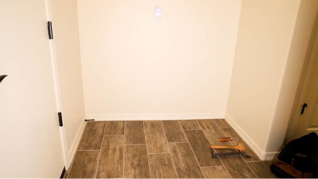 Empty entryway nook before installing the custom DIY mudroom built-in