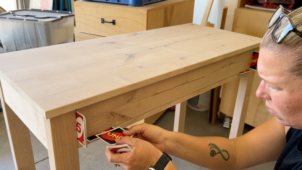 using playing cards to set the 1/8" reveal for the drawer front on the table