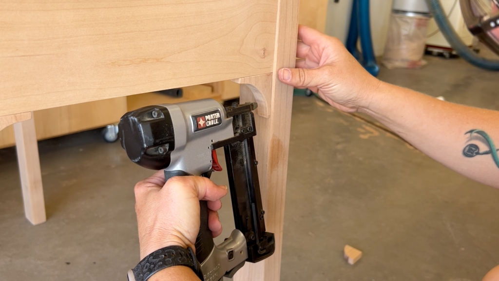 nailing the cove molding to the table legs