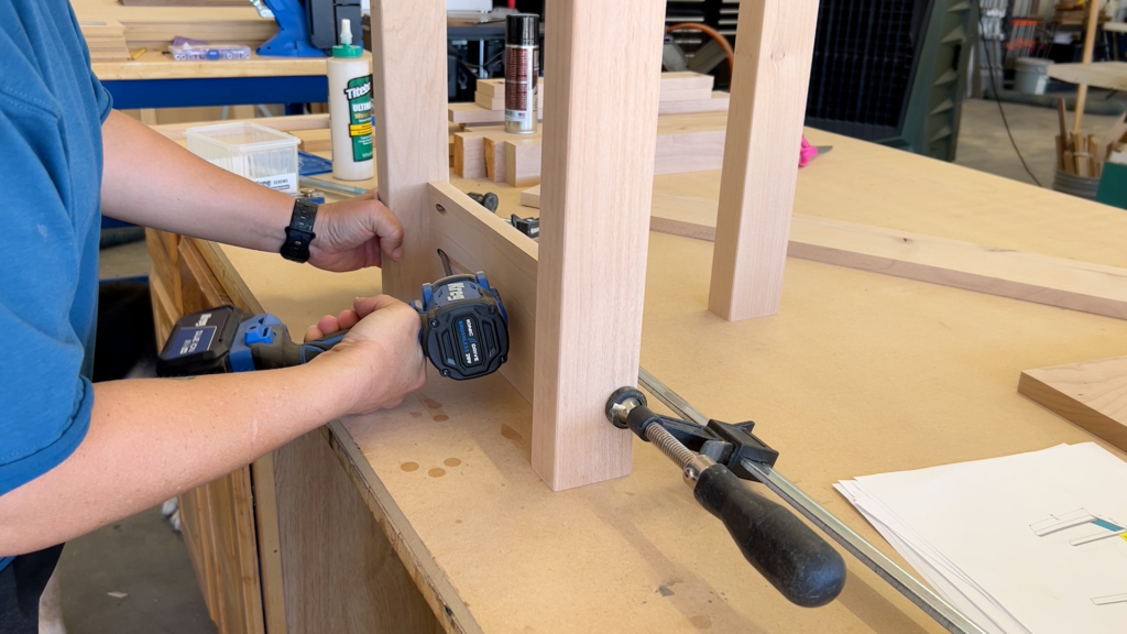 DIY makeup table apron attached to leg with pocket hole screws and clamp