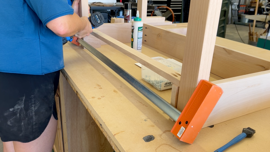 front apron clamped in place and being attached with pocket screws and impact driver