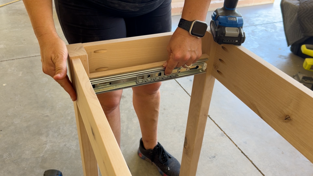 attaching outer drawer slide to table frame